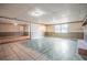 The spacious basement features mixed flooring, a brick fireplace, and neutral-colored walls at 415 Manor Dr, Bartow, FL 33830