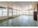 The sunroom features lots of windows allowing in natural light and a vintage-style flooring at 415 Manor Dr, Bartow, FL 33830
