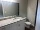 Bathroom with elegant granite countertop and a large mirror above the sink at 420 S 9Th Ave, Bartow, FL 33830