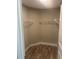 Walk-in closet featuring laminate floors and white wire shelving for optimal organization at 420 S 9Th Ave, Bartow, FL 33830