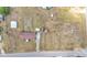 Sprawling property featuring a mobile home, outbuildings, and extensive fenced yard space from an aerial view at 4207 Ollie Rd, Lakeland, FL 33810
