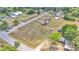 Extensive property featuring a mobile home, sheds, and ample land, captured from an aerial perspective showing the surroundings at 4207 Ollie Rd, Lakeland, FL 33810