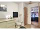 Bathroom showcasing a vanity, toilet, and a door to the bedroom at 4404 Musket Dr, Lakeland, FL 33810
