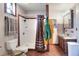 Bathroom featuring a shower with brown polka dot curtain, matching accessories, and vintage style tile floors at 4404 Musket Dr, Lakeland, FL 33810