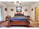 Cozy bedroom featuring a wooden bed frame, ceiling fan, and natural light at 4404 Musket Dr, Lakeland, FL 33810