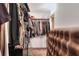 Walk-in closet featuring clothes, bags and a carpeted floor at 4404 Musket Dr, Lakeland, FL 33810