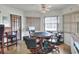 Features a poker table, natural light, and door leading to outdoor space at 4404 Musket Dr, Lakeland, FL 33810