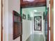 Unique hallway with custom wood features, neutral walls, and modern lighting at 4404 Musket Dr, Lakeland, FL 33810
