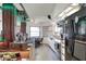 Open layout with modern appliances, a bar area, and adjacent game table at 4404 Musket Dr, Lakeland, FL 33810