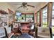 Entertaining sunroom with comfortable seating and bar, creating a unique and inviting space for relaxation and socializing at 4404 Musket Dr, Lakeland, FL 33810