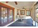 Inviting sunroom with multiple windows, ceiling fans, and comfortable seating at 4404 Musket Dr, Lakeland, FL 33810