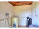 Interior view of pump, water conditioner, and water tank inside well house at 4404 Musket Dr, Lakeland, FL 33810
