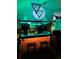 A bar with lighting and decorative accents and two stools for seating at 4404 Musket Dr, Lakeland, FL 33810