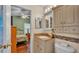 Cozy bathroom features granite countertops, stylish mosaic tile, and ample cabinet storage at 506 Henley Cir, Davenport, FL 33896