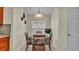 Cozy dining area features a table set for four with natural light from the window at 506 Henley Cir, Davenport, FL 33896