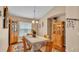 Formal dining area showcasing classic furnishings and a warm ambiance with wooden table and chairs at 506 Henley Cir, Davenport, FL 33896
