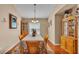 Traditional dining room with hardwood floors, a decorative chandelier, and elegant furnishings at 506 Henley Cir, Davenport, FL 33896