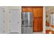 Modern stainless steel refrigerator and ample wooden cabinet space, perfect for kitchen storage at 506 Henley Cir, Davenport, FL 33896