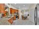 Well-lit kitchen featuring stainless steel appliances, granite countertops, and a breakfast nook area at 506 Henley Cir, Davenport, FL 33896