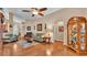 Expansive living room with hardwood floors, and display case at 506 Henley Cir, Davenport, FL 33896
