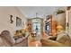 Bright living room with vaulted ceilings and sliding glass doors to the lanai at 506 Henley Cir, Davenport, FL 33896