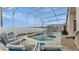Inviting screened pool area with comfortable lounge chairs for relaxing outdoors at 506 Henley Cir, Davenport, FL 33896