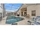 Inviting screened pool area with comfortable lounge chairs for relaxing outdoors at 506 Henley Cir, Davenport, FL 33896
