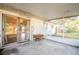 Covered back patio extends living space outdoors, ideal for relaxation or entertaining with backyard access at 526 Marklen Loop, Polk City, FL 33868