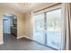 Bright dining area with tile flooring, sliding glass doors, and access to the kitchen at 526 Marklen Loop, Polk City, FL 33868