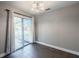 Cozy dining area with tile floors, a sliding door to the outside, and neutral walls at 526 Marklen Loop, Polk City, FL 33868
