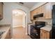 Well-equipped kitchen with a view into a dining area and tile flooring at 526 Marklen Loop, Polk City, FL 33868