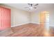 Inviting living room with beautiful hardwood floors and an open archway at 526 Marklen Loop, Polk City, FL 33868