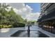 Beautiful water fountain adding a touch of elegance to the building's exterior, with lush greenery at 530 E Central Blvd # 405, Orlando, FL 32801