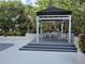 Relaxing outdoor gazebo with seating, perfect for enjoying the lush landscaping and fresh air at 530 E Central Blvd # 405, Orlando, FL 32801