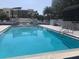 Refreshing swimming pool with crystal-clear water and inviting lounge chairs at 530 E Central Blvd # 405, Orlando, FL 32801