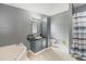 A full bathroom featuring a tub, vanity, toilet, and cabinet for ample storage at 5339 Meadow Grove Trl, Lakeland, FL 33810