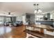Spacious living area with open layout, wood floors, and a comfortable sectional couch at 5339 Meadow Grove Trl, Lakeland, FL 33810