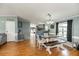 Bright dining and living area featuring beautiful wood floors and updated decor at 5339 Meadow Grove Trl, Lakeland, FL 33810