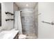 Bathroom featuring a modern walk-in shower with tiled walls and a built-in shower seat at 5604 Stratford Ln, Lakeland, FL 33813