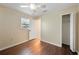 Cozy bedroom featuring hardwood flooring and a spacious closet at 5604 Stratford Ln, Lakeland, FL 33813