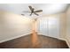 Bedroom with ceiling fan, hardwood floors, closet, and natural light at 5604 Stratford Ln, Lakeland, FL 33813