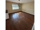 Dining room with dark floors and chandelier at 5604 Stratford Ln, Lakeland, FL 33813