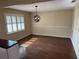 Dining room with dark floors and chandelier at 5604 Stratford Ln, Lakeland, FL 33813