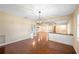 Dining room with hardwood floor open to other living spaces at 5604 Stratford Ln, Lakeland, FL 33813