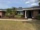 Charming single-story brick home with well-maintained landscaping, enhancing its curb appeal at 5604 Stratford Ln, Lakeland, FL 33813