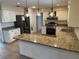 Kitchen with stainless steel appliances and granite countertops at 5604 Stratford Ln, Lakeland, FL 33813