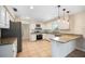 Well-lit kitchen featuring granite countertops, stainless steel appliances, and neutral tile flooring at 5604 Stratford Ln, Lakeland, FL 33813