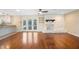 Inviting living room with fireplace, hardwood floors, and a view of the outdoor pool area at 5604 Stratford Ln, Lakeland, FL 33813