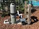 Pool equipment with filter and pump on mulch bed at 5604 Stratford Ln, Lakeland, FL 33813