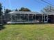 A screened-in pool enclosure and paver deck at 5604 Stratford Ln, Lakeland, FL 33813